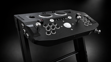 Arcade2TV-XR MAX two-player arcade and pinball control deck on its pedestal — three-quarter studio view