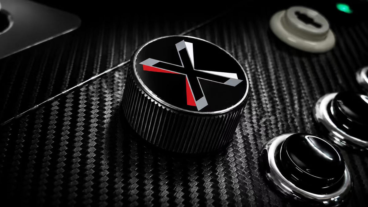 A front-mounted spinner knob carrying the X-Arcade mark